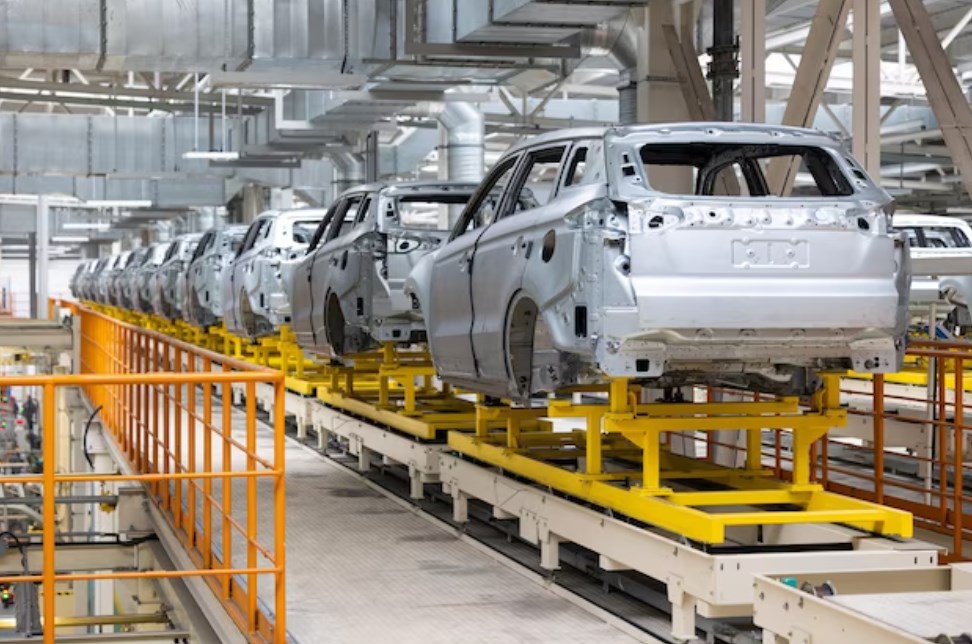 automobile production line with unpainted vehicle bodies