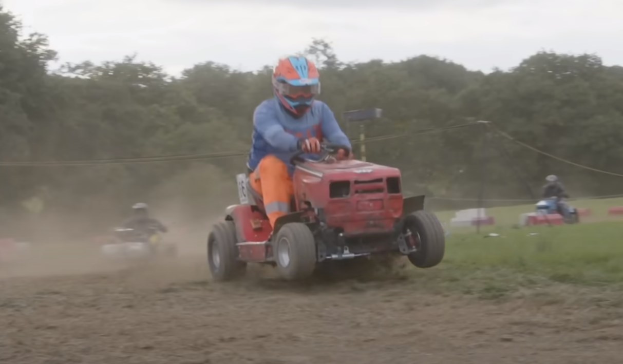 a man racing a modified lawnmower