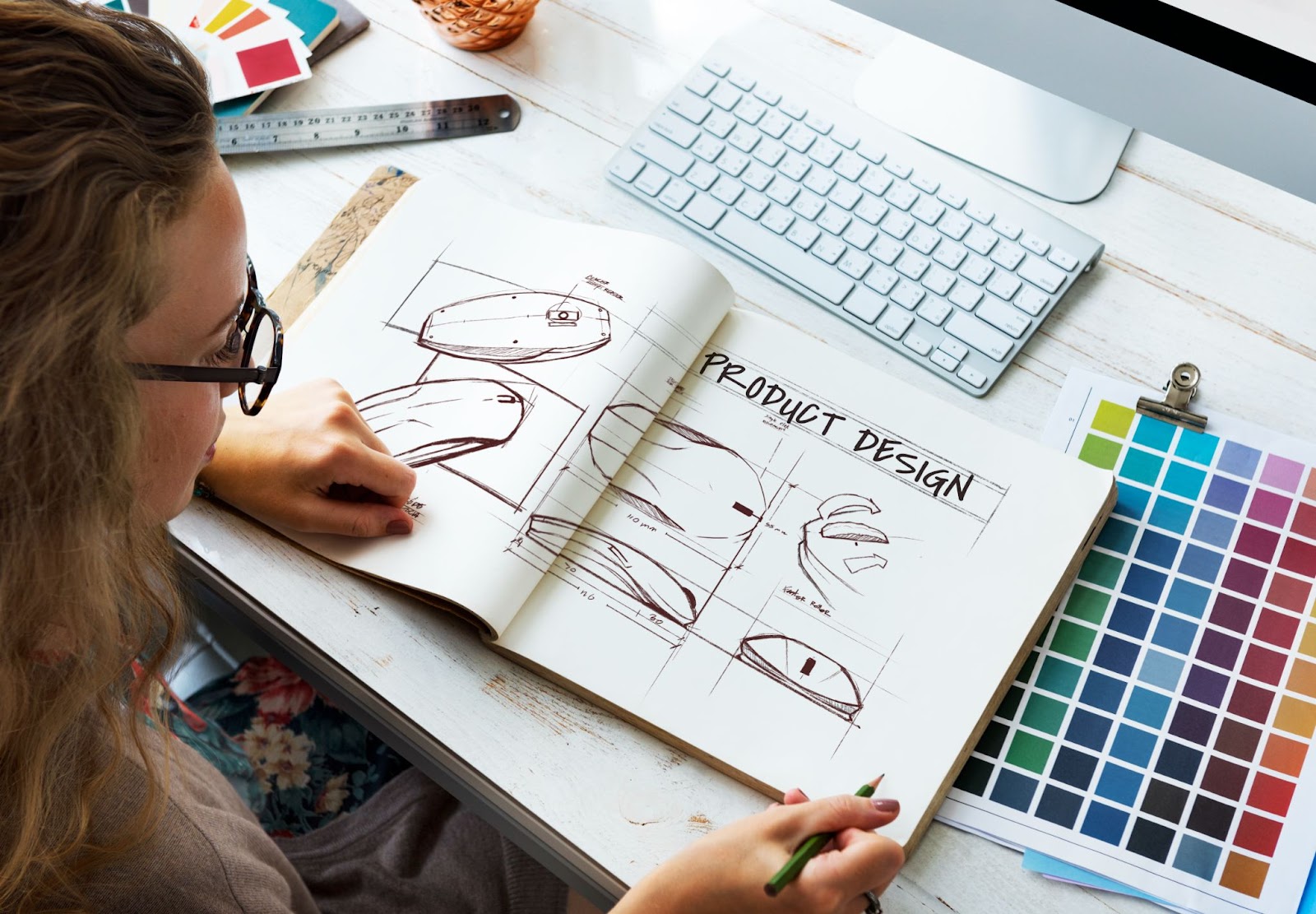 Top view of woman creating product design